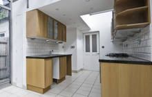 Modest Corner kitchen extension leads